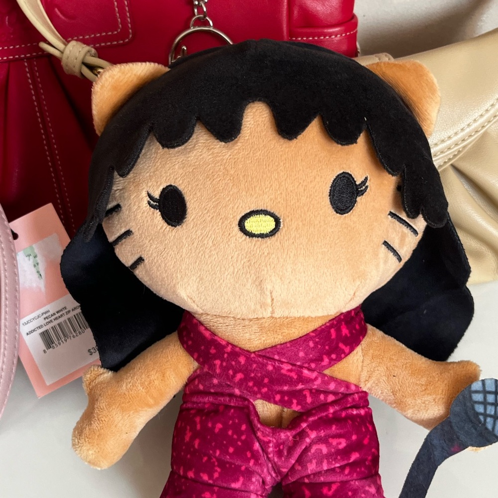 Cute Plush Doll with Black Hair and Pink Outfit
